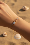 Bracelet doré fleur strass