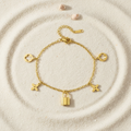 Bracelet trèfles cadenas sur sable